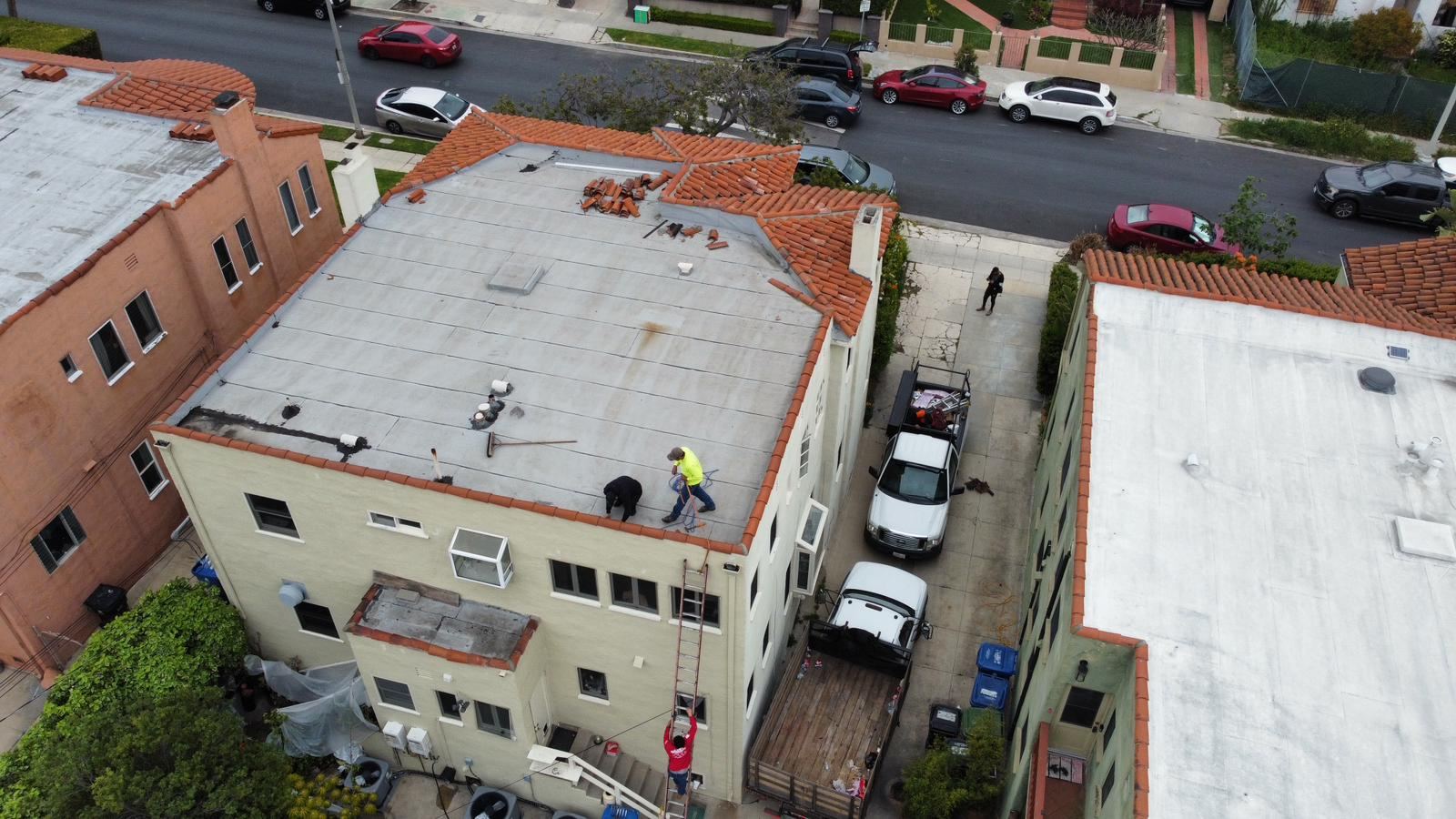 AEL Roofing crew on an apartment building roof