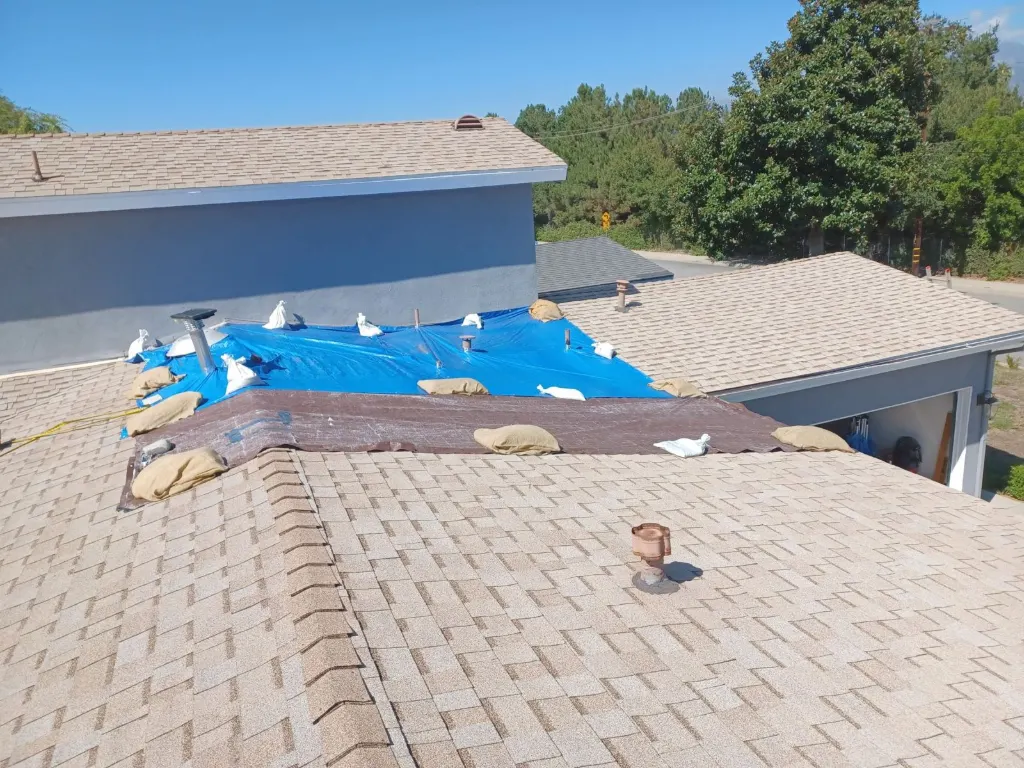 Roof tarped before a leak repair