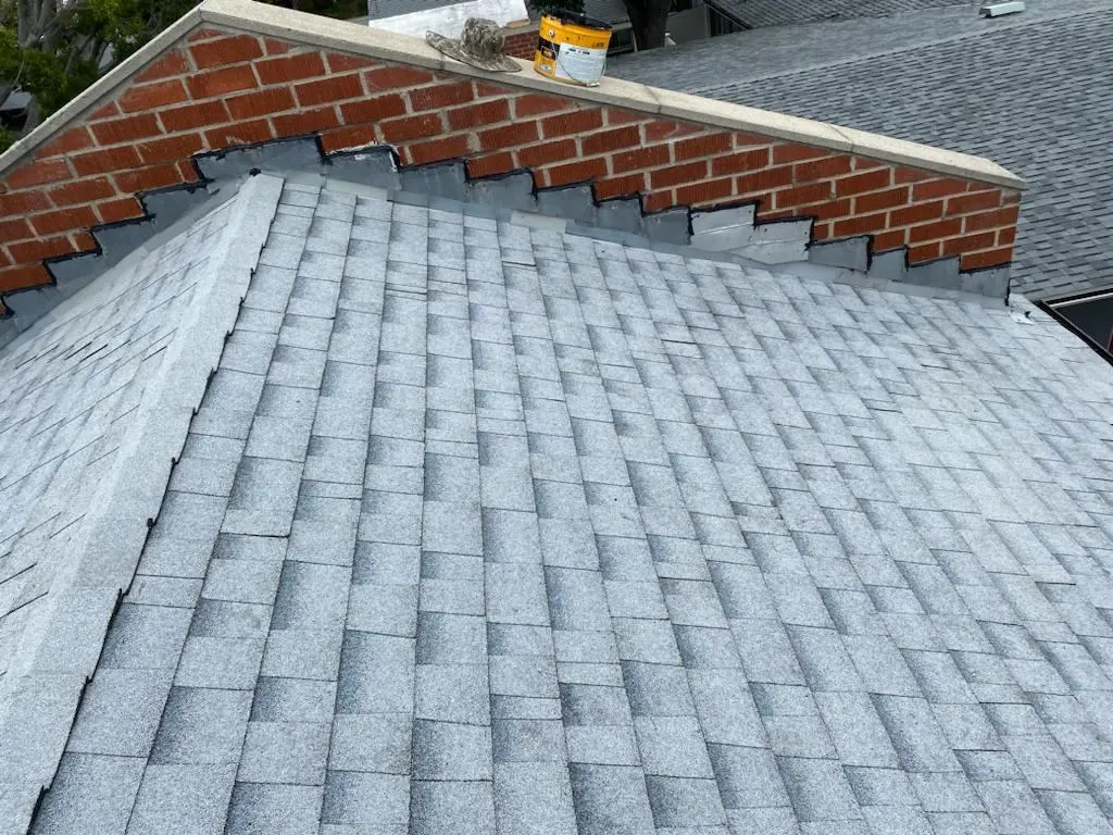 New step flashing at a brick wall
