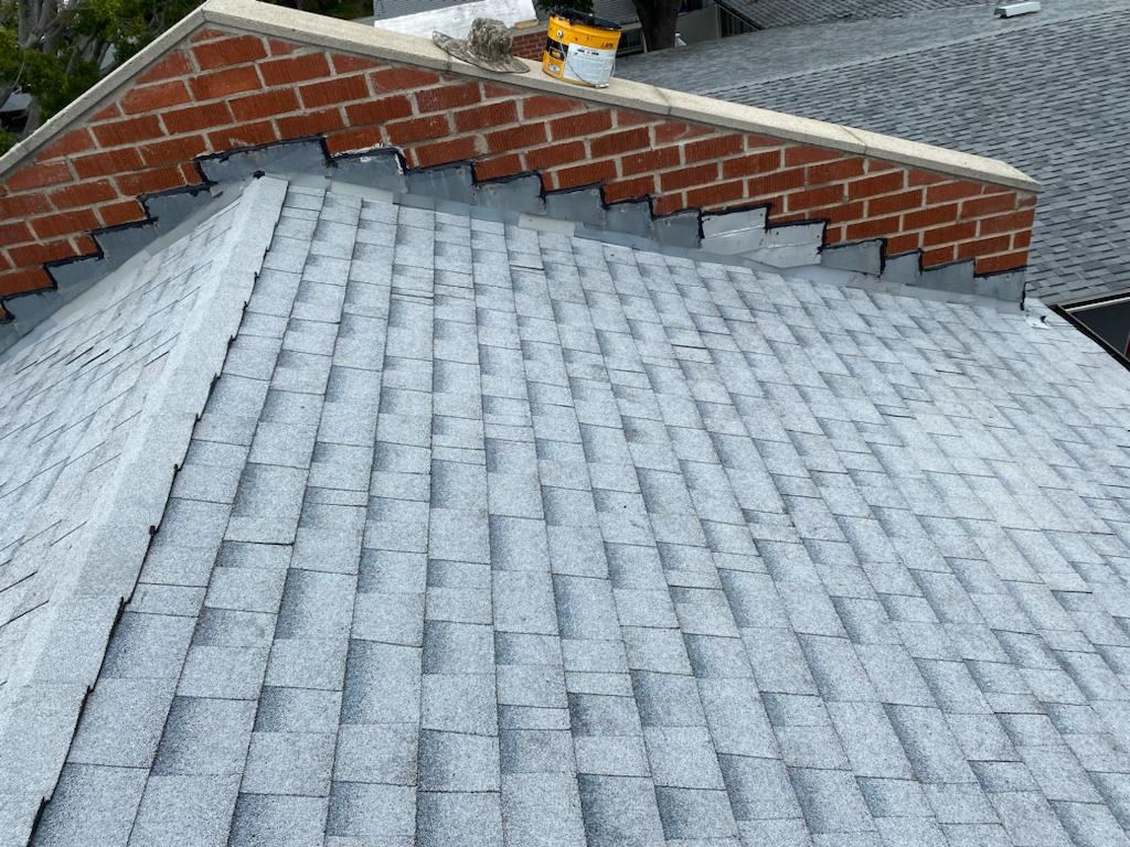 Step flashing at a brick wall